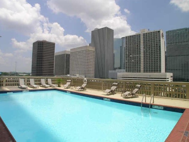 2016 Main Street, Unit 2507 Houston, TX 77002 - Photo 26 of 32 a view of a swimming pool with chairs