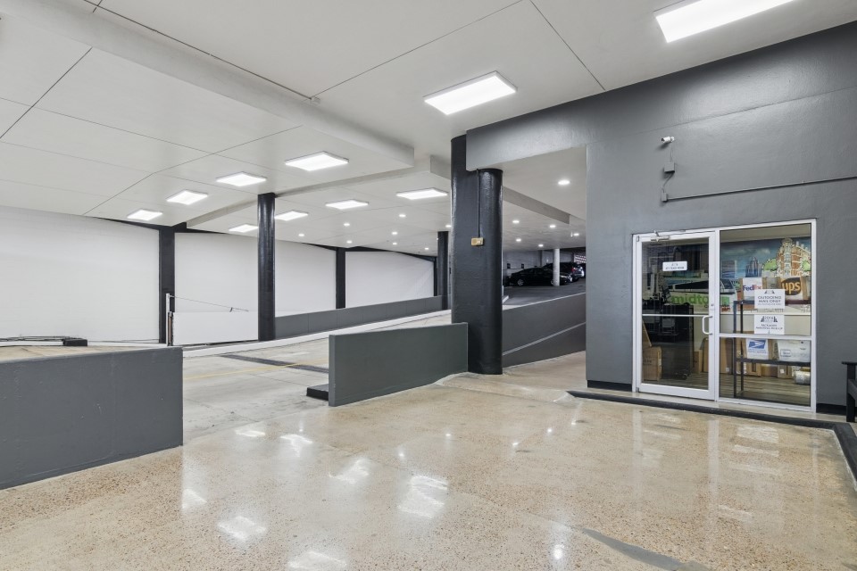 2016 Main Street, Unit 2507 Houston, TX 77002 - Photo 32 of 32 a large hall with a large window and chandelier