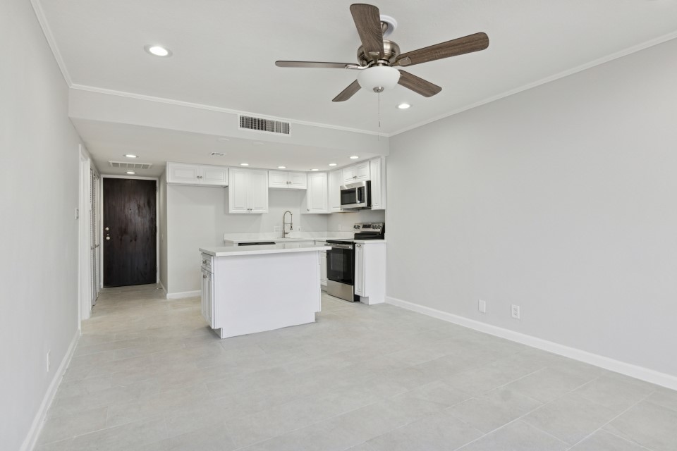 2016 Main Street, Unit 2507 Houston, TX 77002 - Photo 10 of 32 a view of kitchen with stainless steel appliances granite countertop white cabinets and refrigerator
