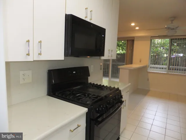 a bathroom with a sink vanity granite and a mirror