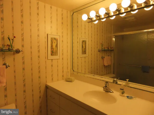 a stove top oven sitting inside of a kitchen