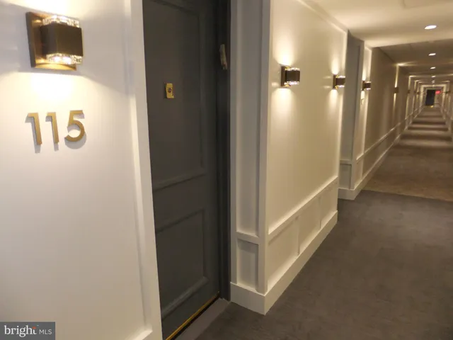 a view of an empty room with glass door