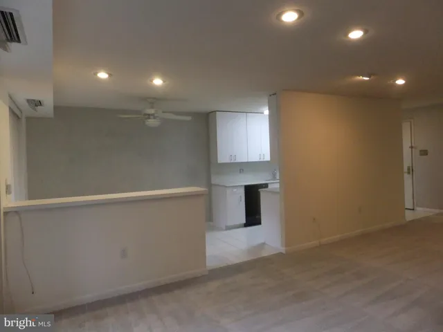 a kitchen with a refrigerator and a sink