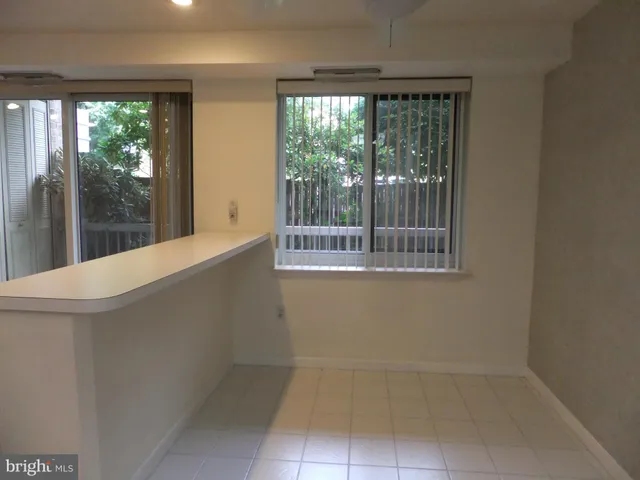 a kitchen with a sink stove and refrigerator