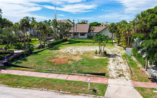 a view of a garden with a building in the background