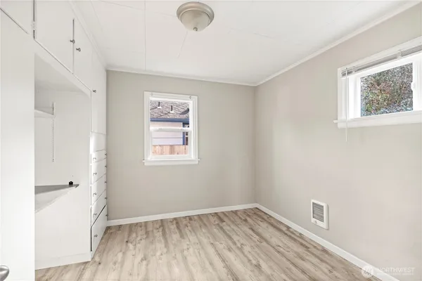 a view of room with window and hardwood floor