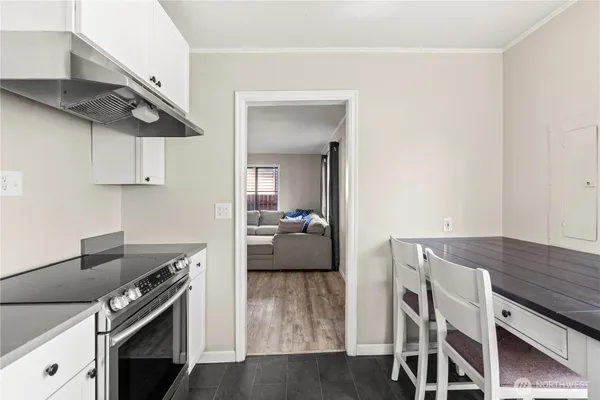 a kitchen with stainless steel appliances a stove a microwave and cabinets