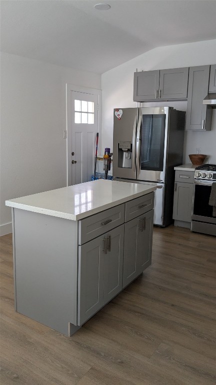 731 Post Street Houston, TX 77022 - Photo 18 of 25 a kitchen with stainless steel appliances granite countertop a sink a microwave a refrigerator and island