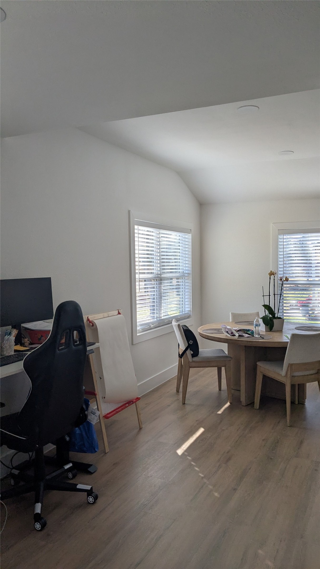 731 Post Street Houston, TX 77022 - Photo 3 of 11 a workspace with furniture and a window