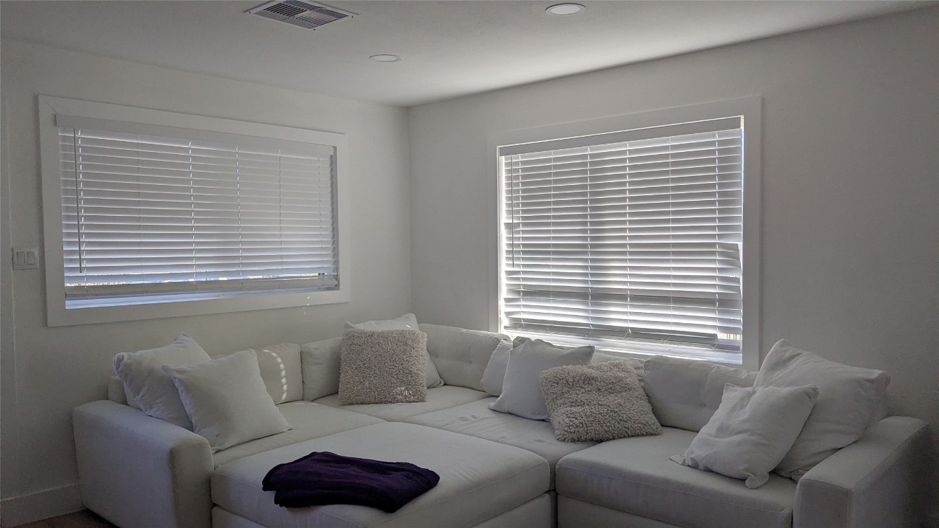 731 Post Street Houston, TX 77022 - Photo 10 of 25 a living room with furniture and a window