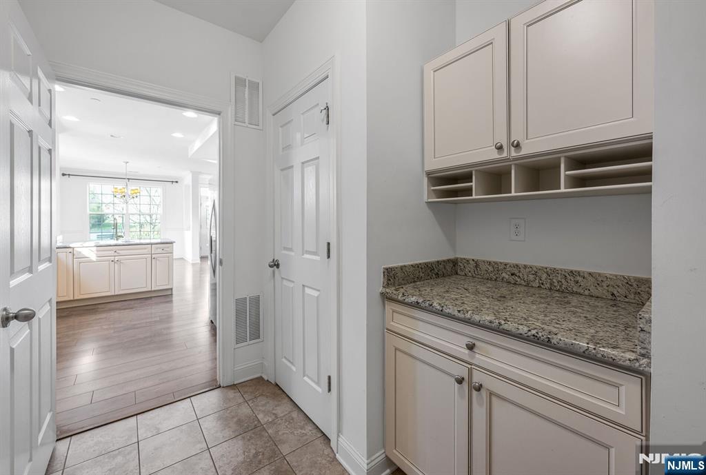63 Autumn Way, Unit 35 Montvale, NJ 07645 - Photo 11 of 27 a kitchen with white cabinets and a window