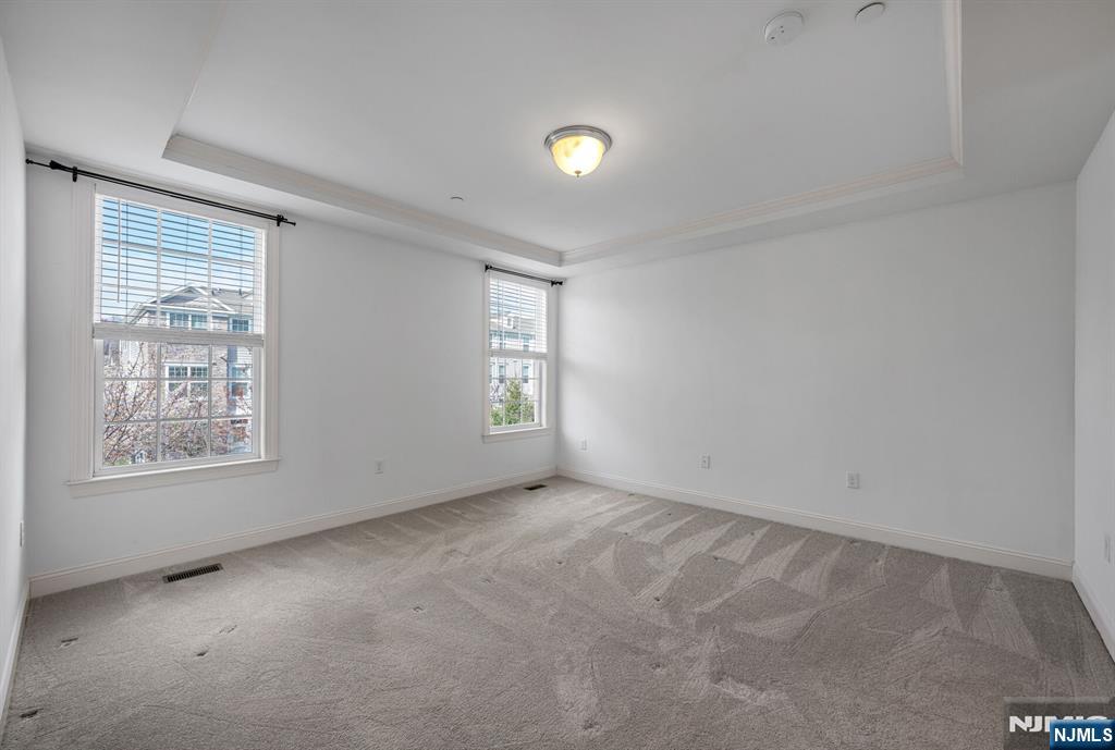 63 Autumn Way, Unit 35 Montvale, NJ 07645 - Photo 13 of 27 an empty room with windows