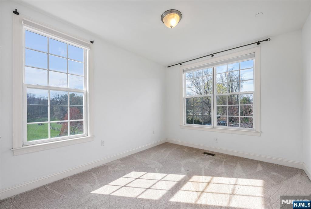 63 Autumn Way, Unit 35 Montvale, NJ 07645 - Photo 18 of 27 an empty room with a window