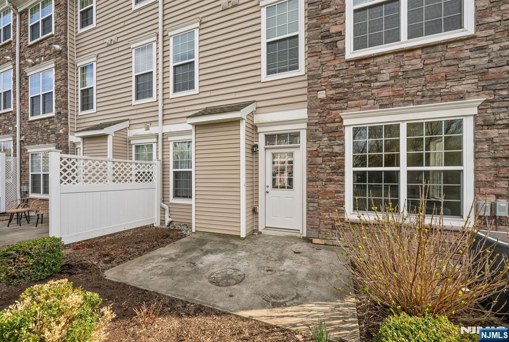 63 Autumn Way, Unit 35 Montvale, NJ 07645 - Photo 21 of 27 a front view of a house with a yard