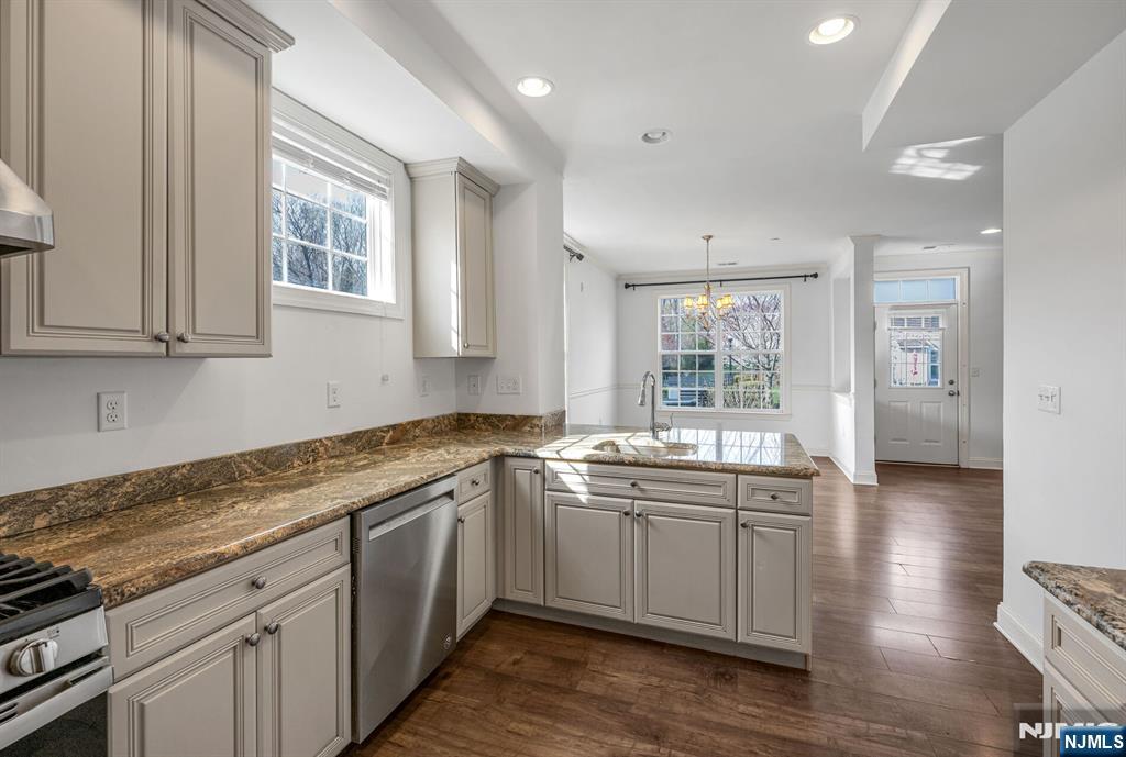 63 Autumn Way, Unit 35 Montvale, NJ 07645 - Photo 8 of 27 a kitchen with a sink stove and cabinets