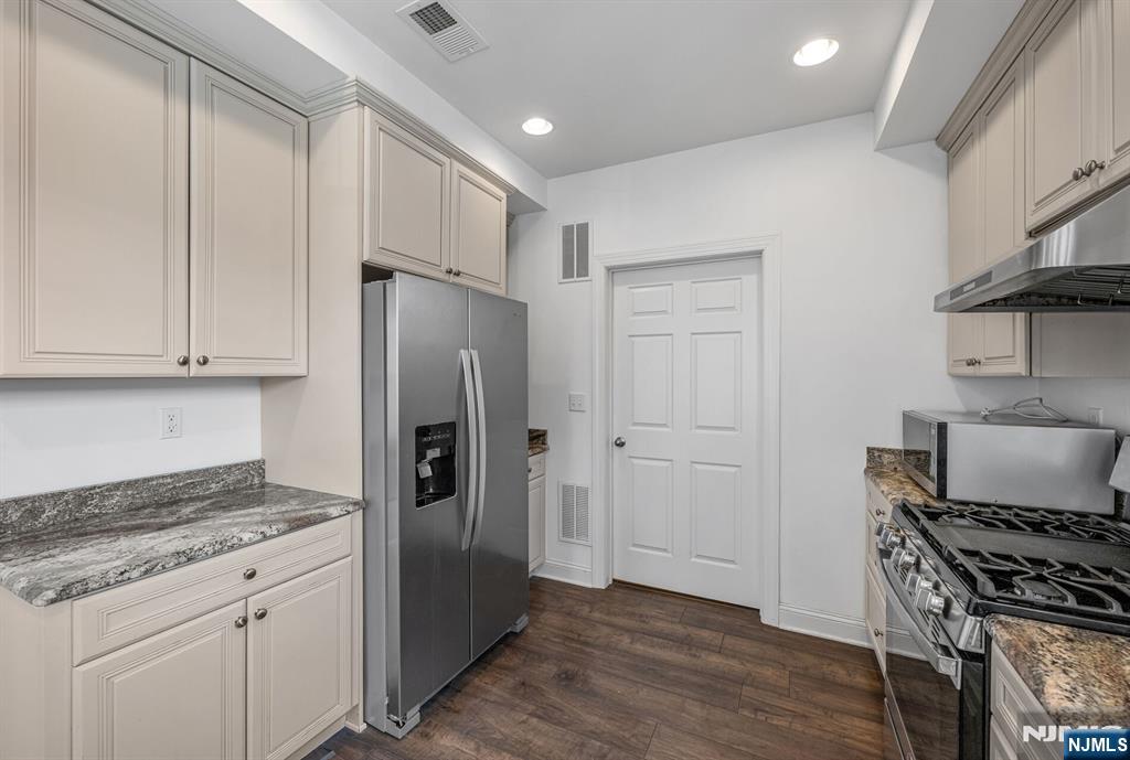 63 Autumn Way, Unit 35 Montvale, NJ 07645 - Photo 10 of 27 a kitchen with stainless steel appliances granite countertop a refrigerator and a stove top oven