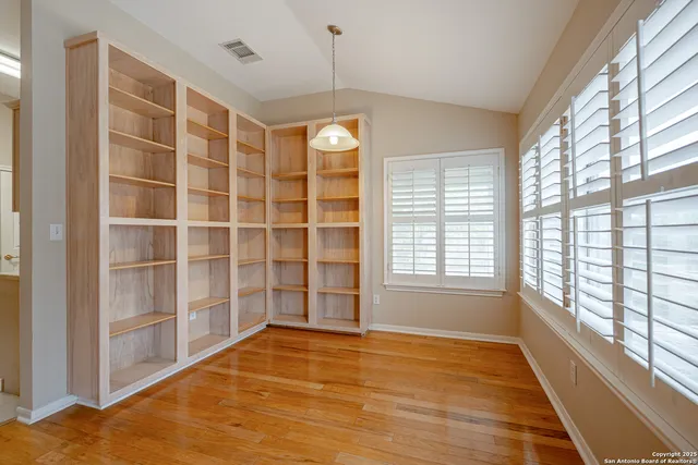 a view of a room with a large window