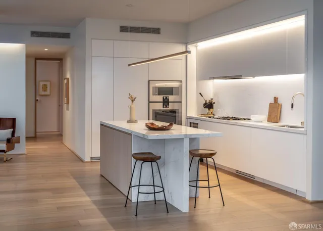 a kitchen with a table and chairs in it
