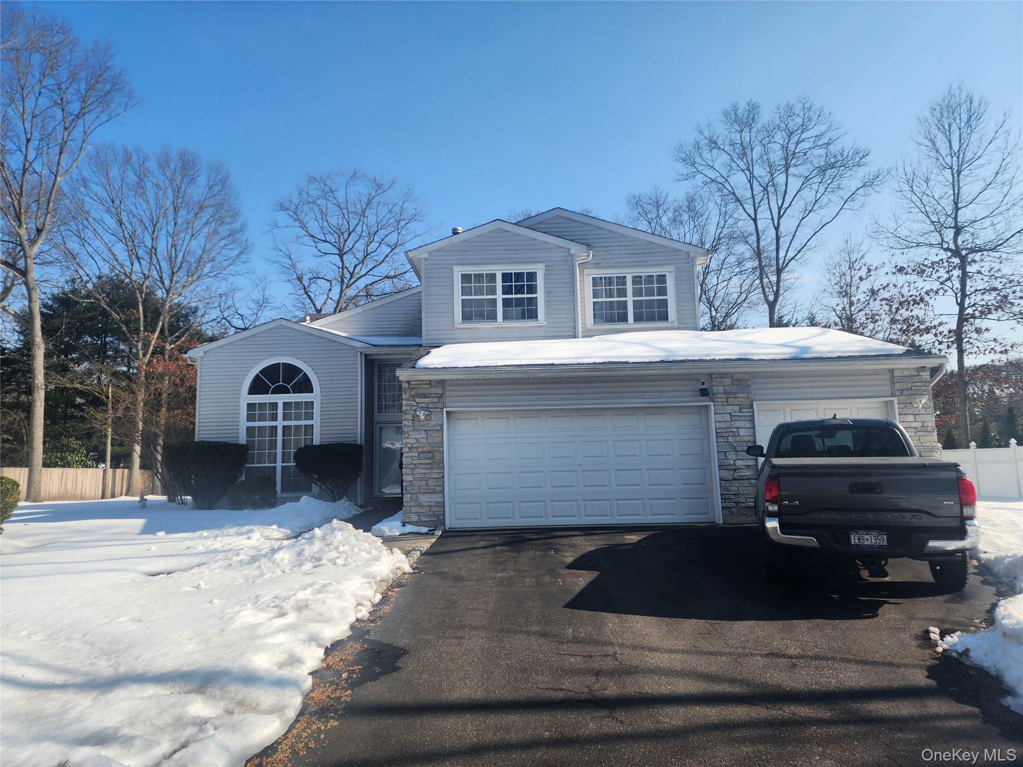3 Arbor Field Way Lake Grove, NY 11755 - Photo 1 of 12 a front view of a house with a yard