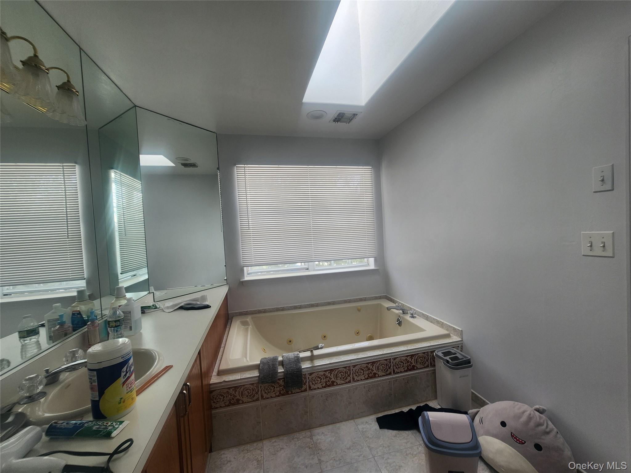 3 Arbor Field Way Lake Grove, NY 11755 - Photo 6 of 12 a room with a wooden floor and a blue wall