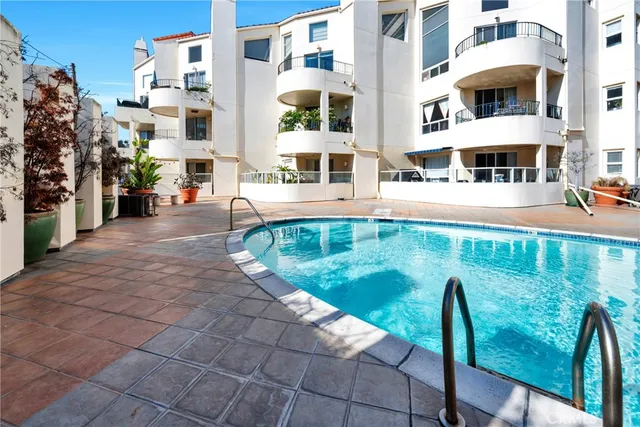 a view of a swimming pool with a lounge chair