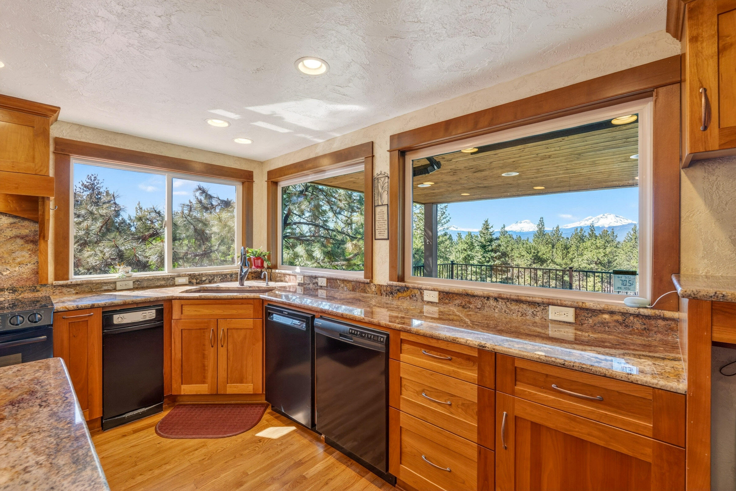69470 Deer Ridge Road Sisters, OR 97759 - Photo 12 of 96 a kitchen with a sink and large window