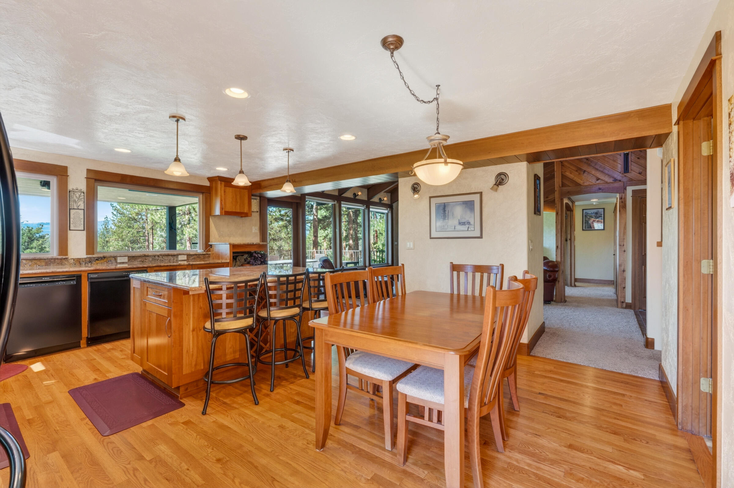 69470 Deer Ridge Road Sisters, OR 97759 - Photo 15 of 96 a view of a dining room with furniture window and wooden floor