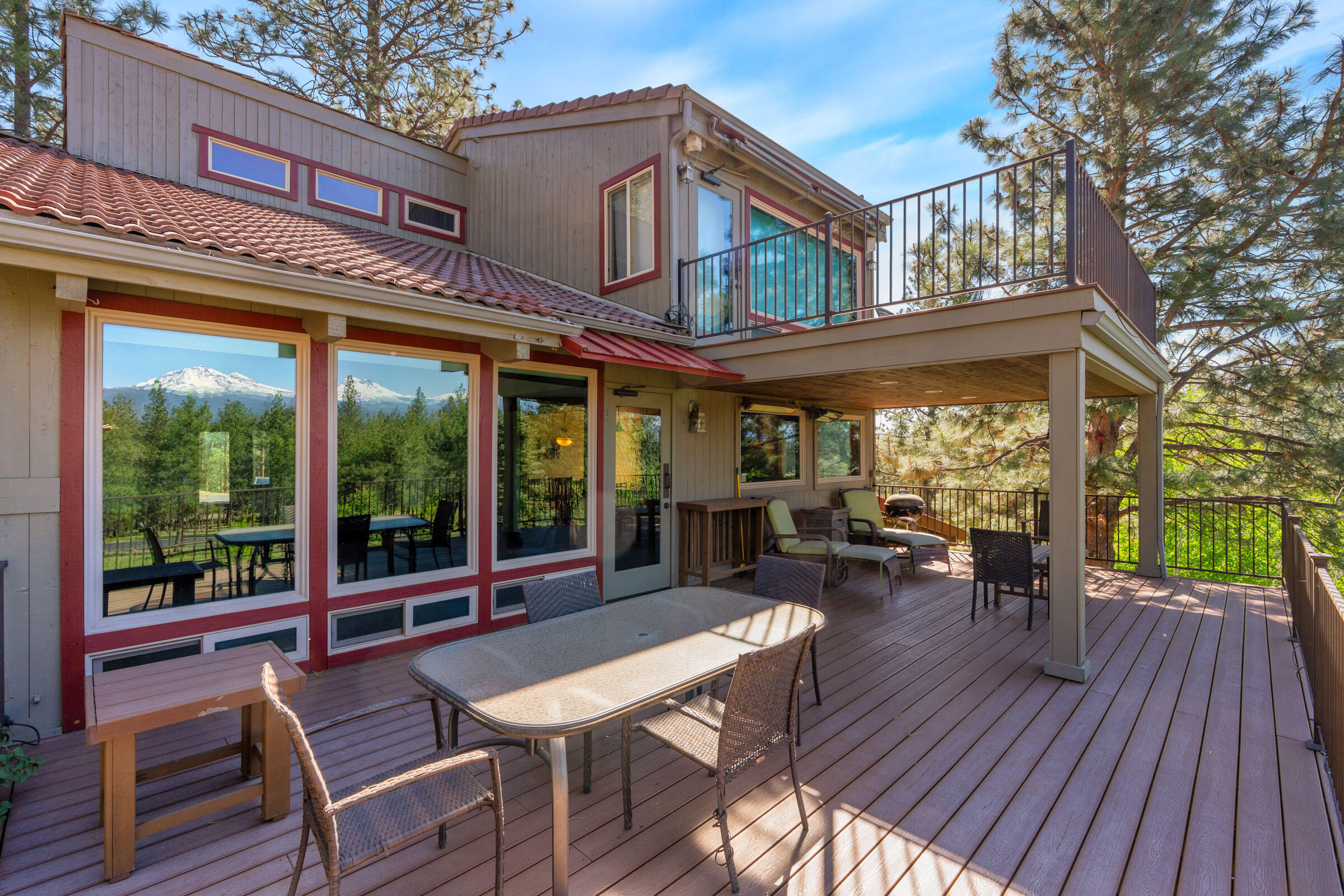69470 Deer Ridge Road Sisters, OR 97759 - Photo 17 of 96 a view of a patio with a table and chairs