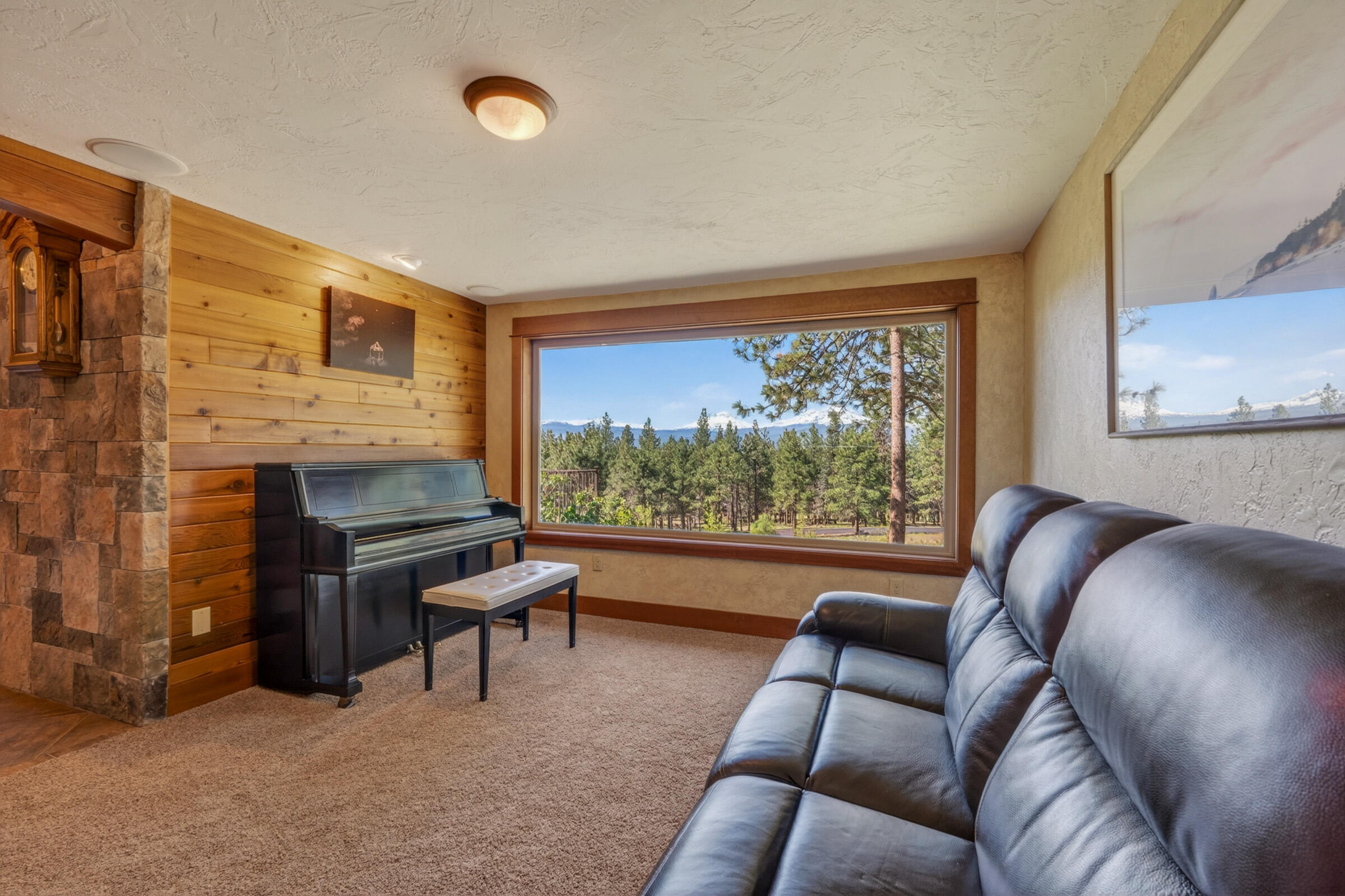 69470 Deer Ridge Road Sisters, OR 97759 - Photo 20 of 96 a living room with furniture and a fireplace