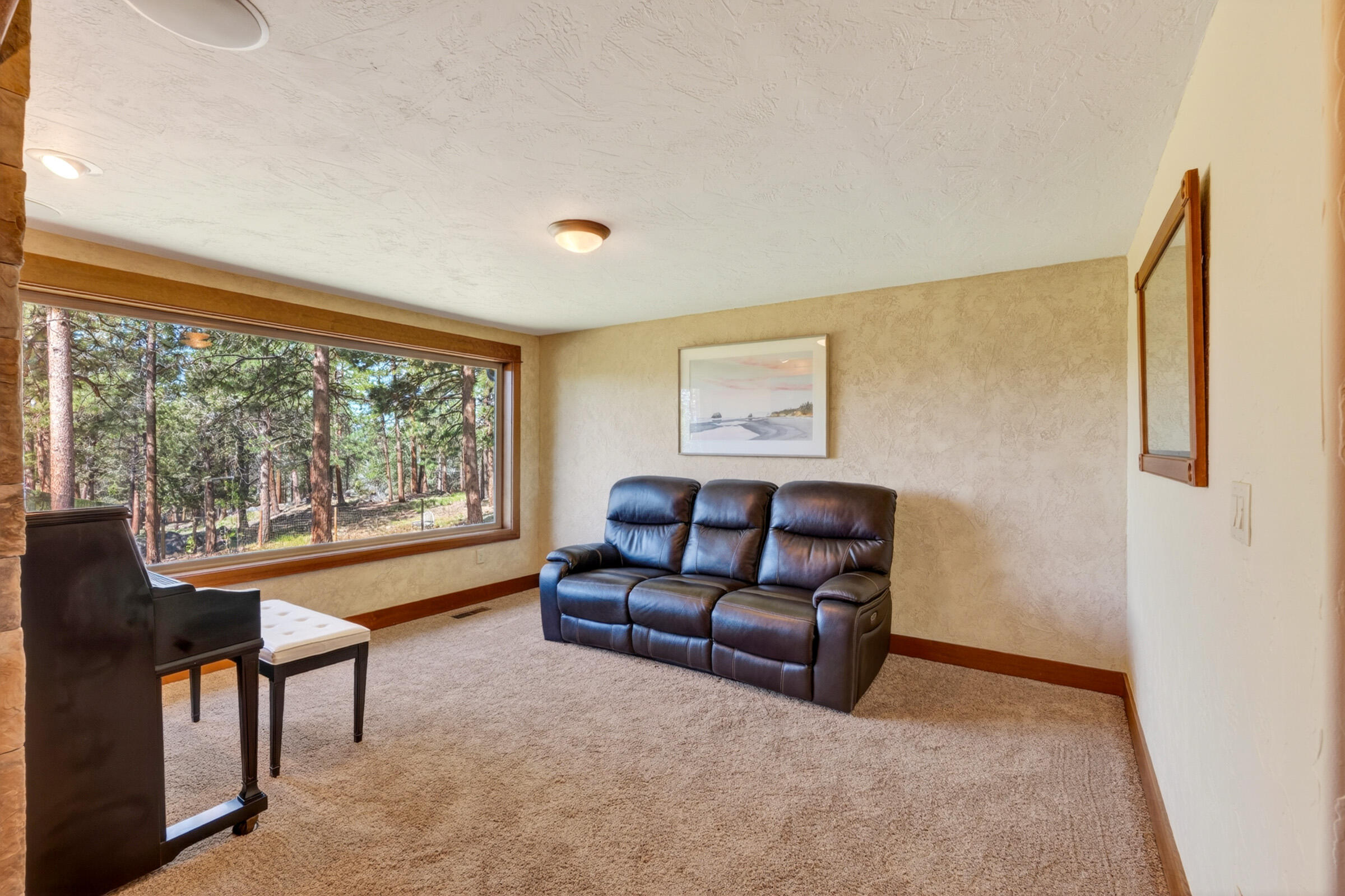 69470 Deer Ridge Road Sisters, OR 97759 - Photo 21 of 96 a living room with furniture and a large window