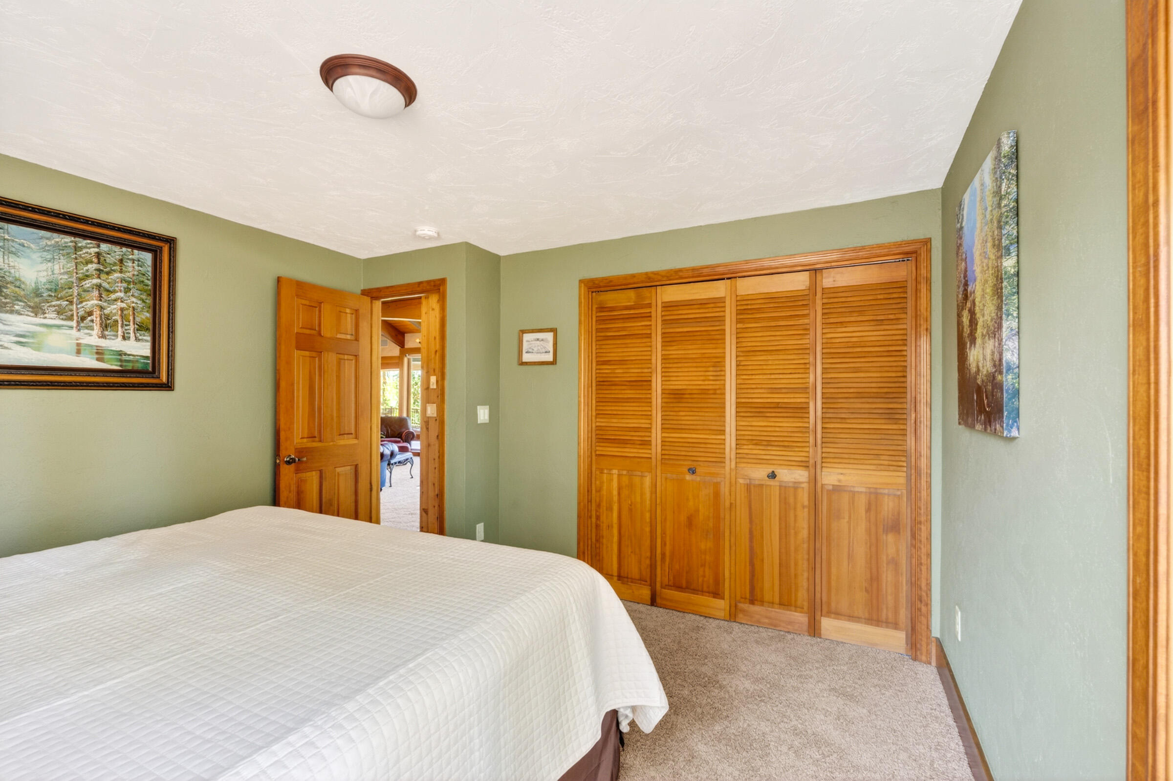 69470 Deer Ridge Road Sisters, OR 97759 - Photo 25 of 96 a bedroom with a bed and a window