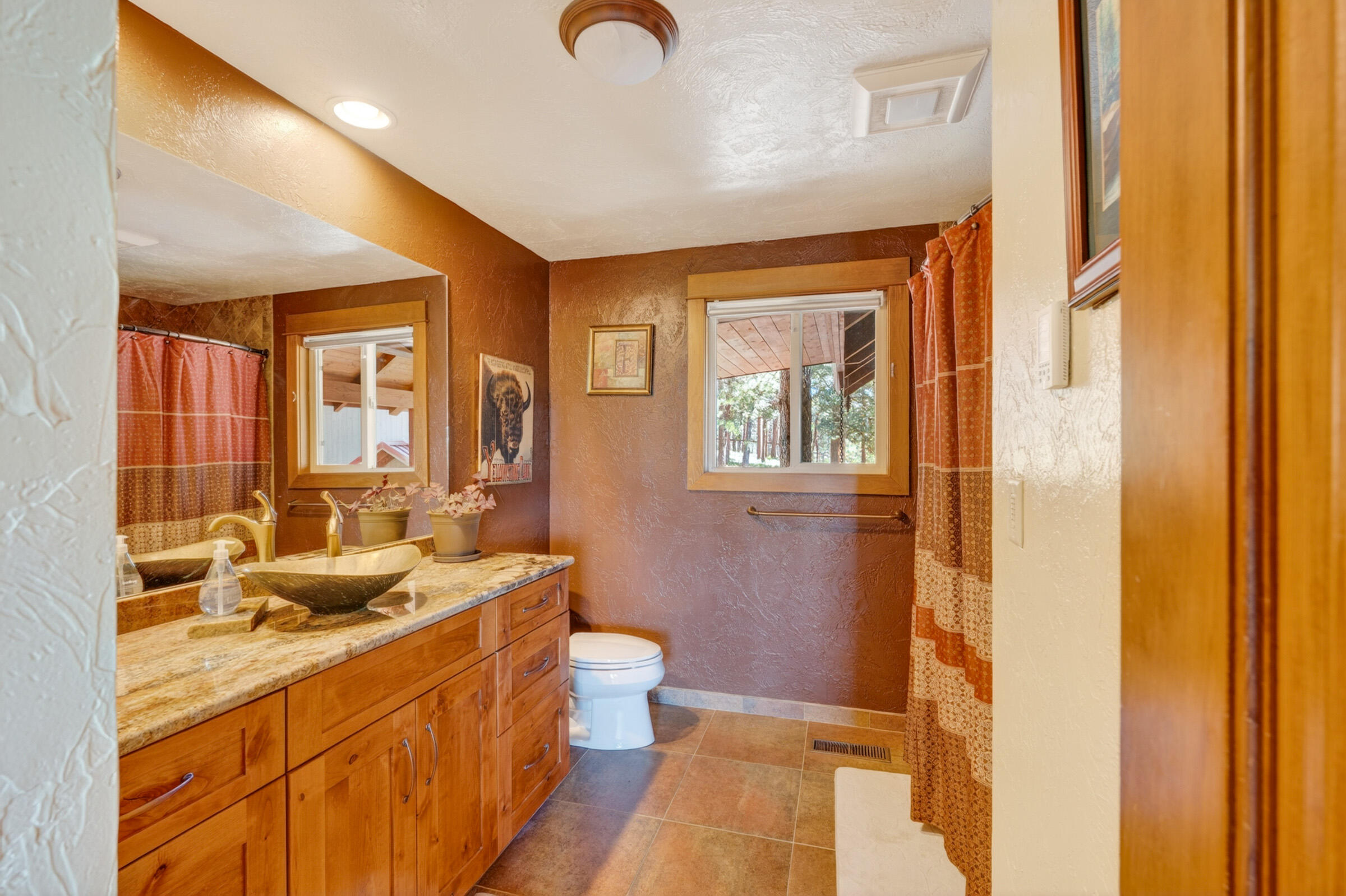 69470 Deer Ridge Road Sisters, OR 97759 - Photo 26 of 96 a bathroom with a sink and a mirror