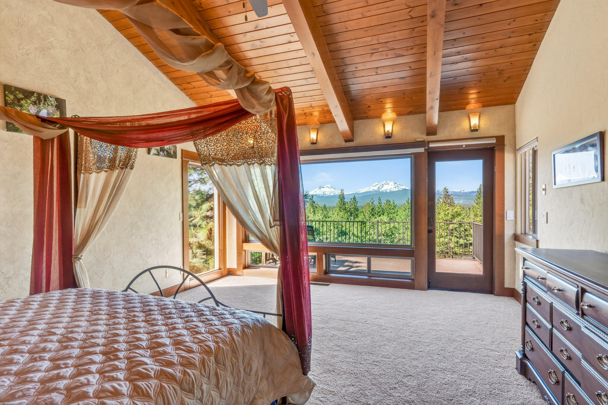 69470 Deer Ridge Road Sisters, OR 97759 - Photo 30 of 96 a bedroom with a bed and a large window