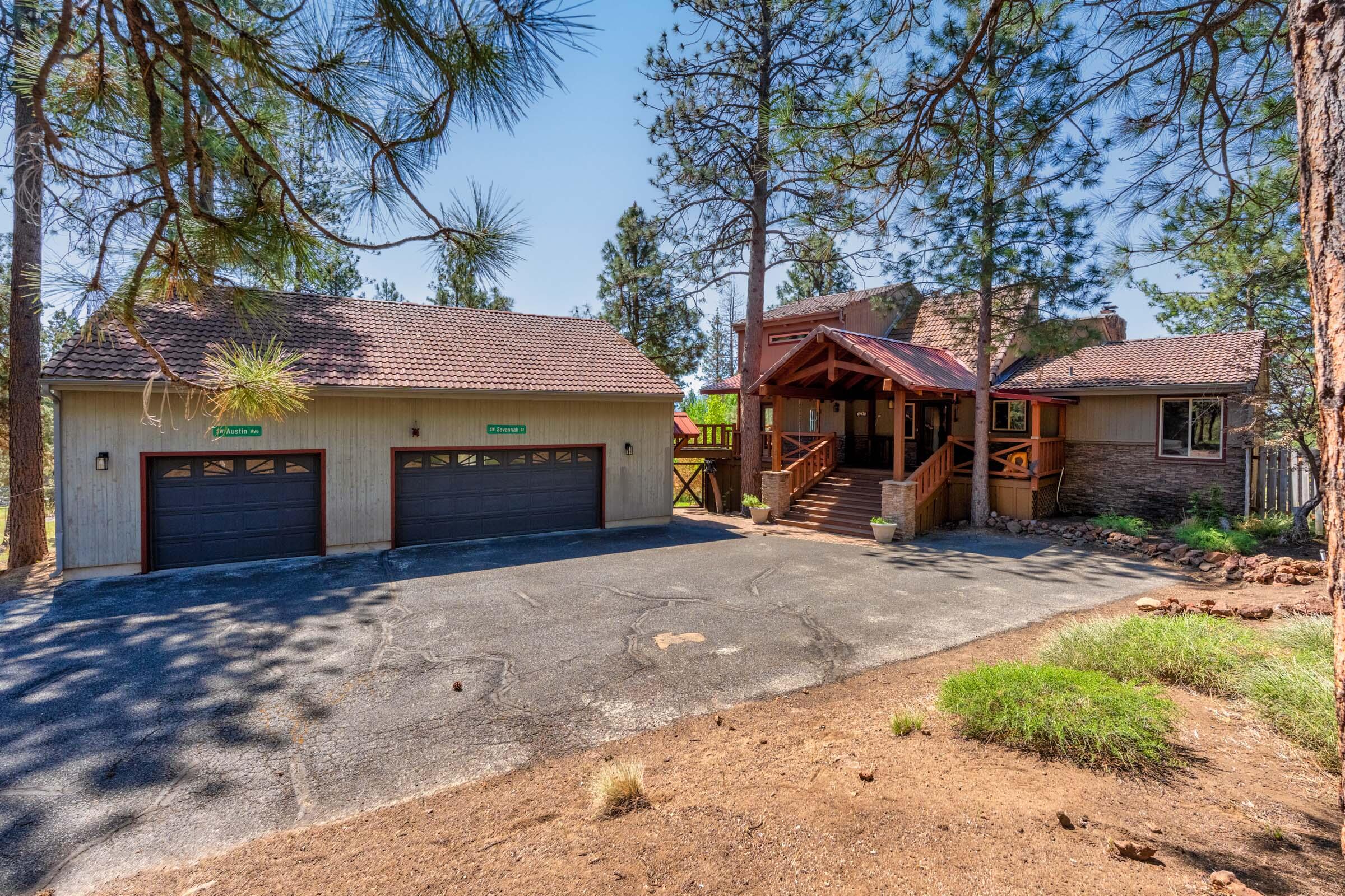 69470 Deer Ridge Road Sisters, OR 97759 - Photo 2 of 96 a front view of a house with a garden