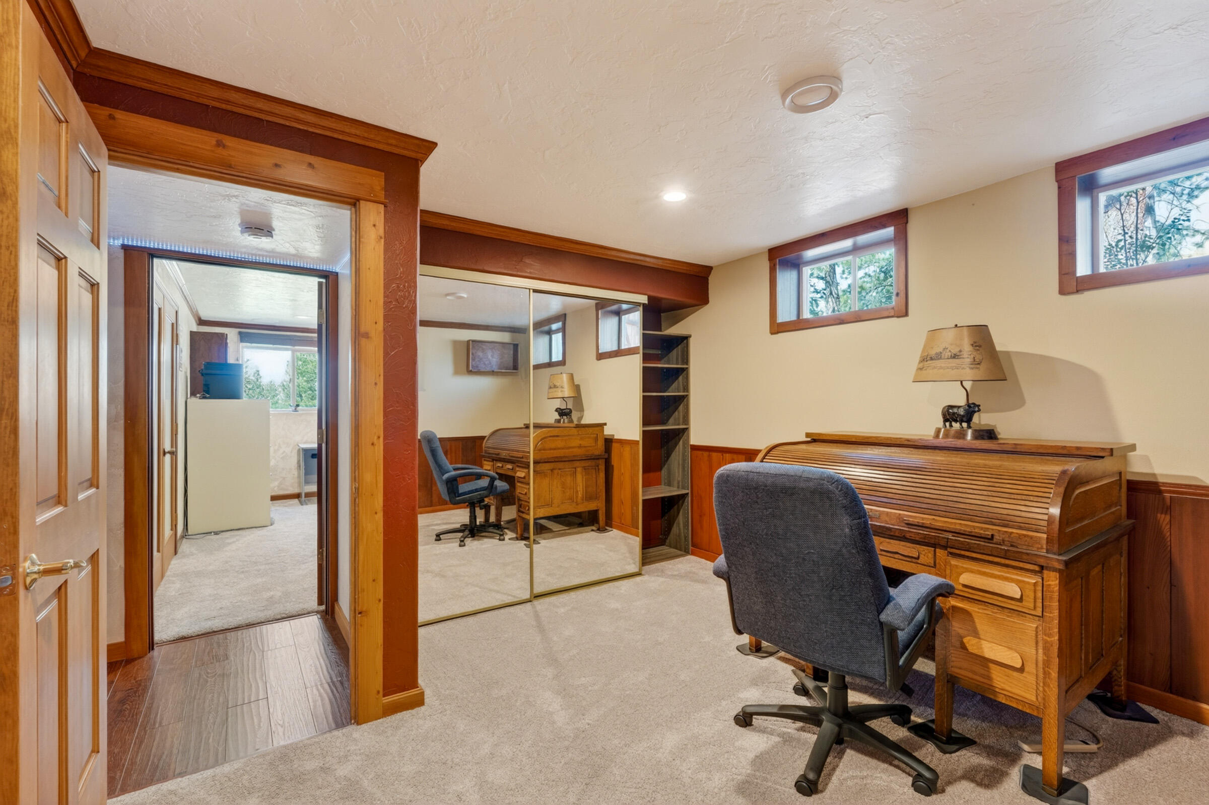 69470 Deer Ridge Road Sisters, OR 97759 - Photo 55 of 96 a view of a workspace with furniture and a livingroom