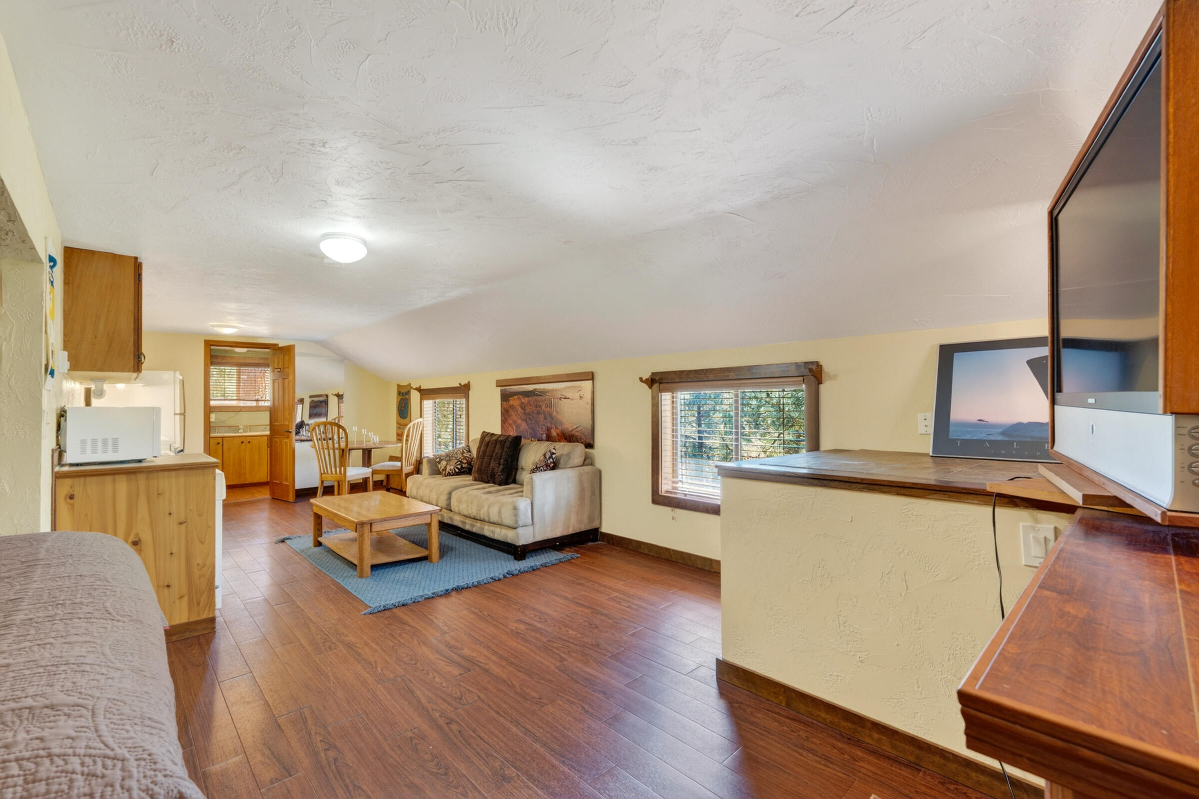 69470 Deer Ridge Road Sisters, OR 97759 - Photo 60 of 96 a living room with furniture and a wooden floor