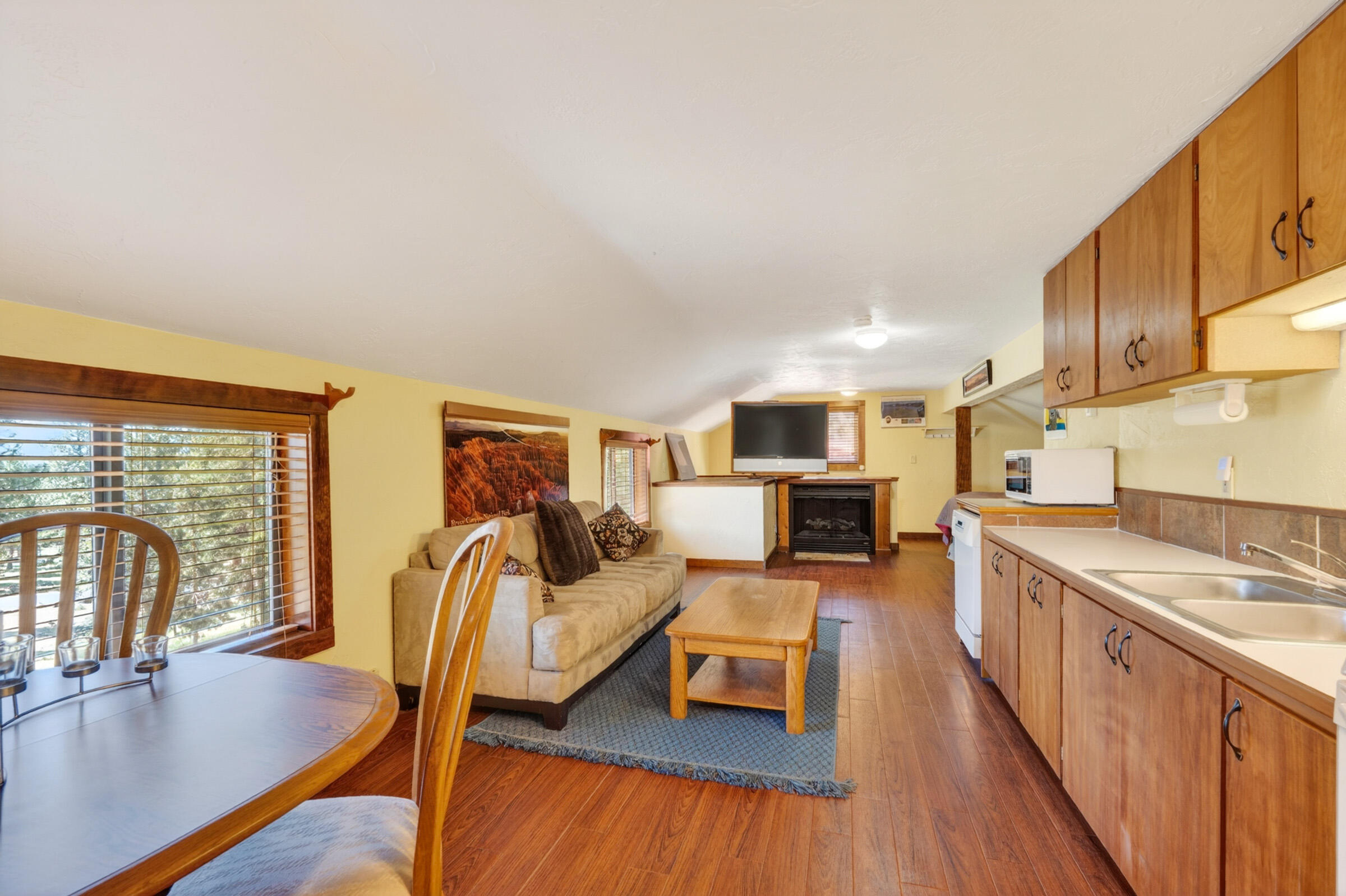 69470 Deer Ridge Road Sisters, OR 97759 - Photo 62 of 96 a living room with furniture and a wooden floor