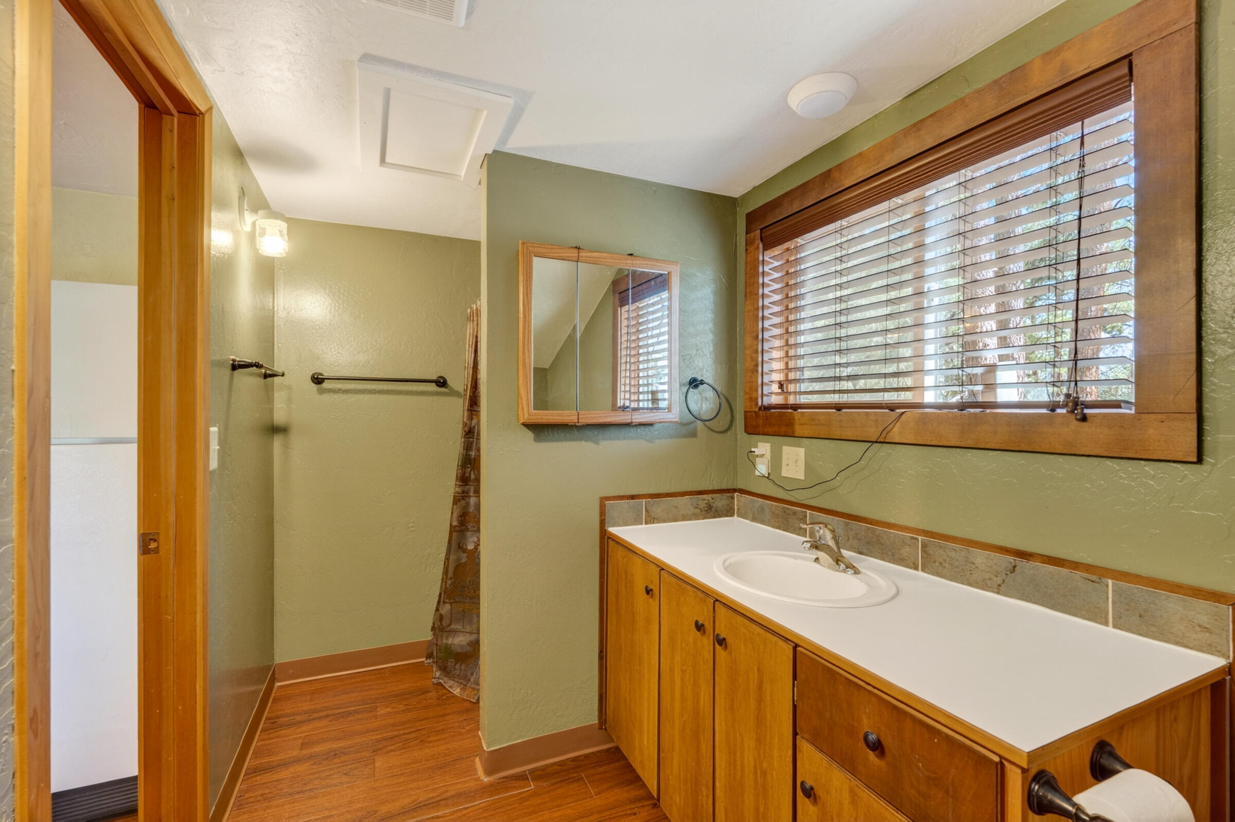 69470 Deer Ridge Road Sisters, OR 97759 - Photo 64 of 96 a bathroom with a sink and a mirror