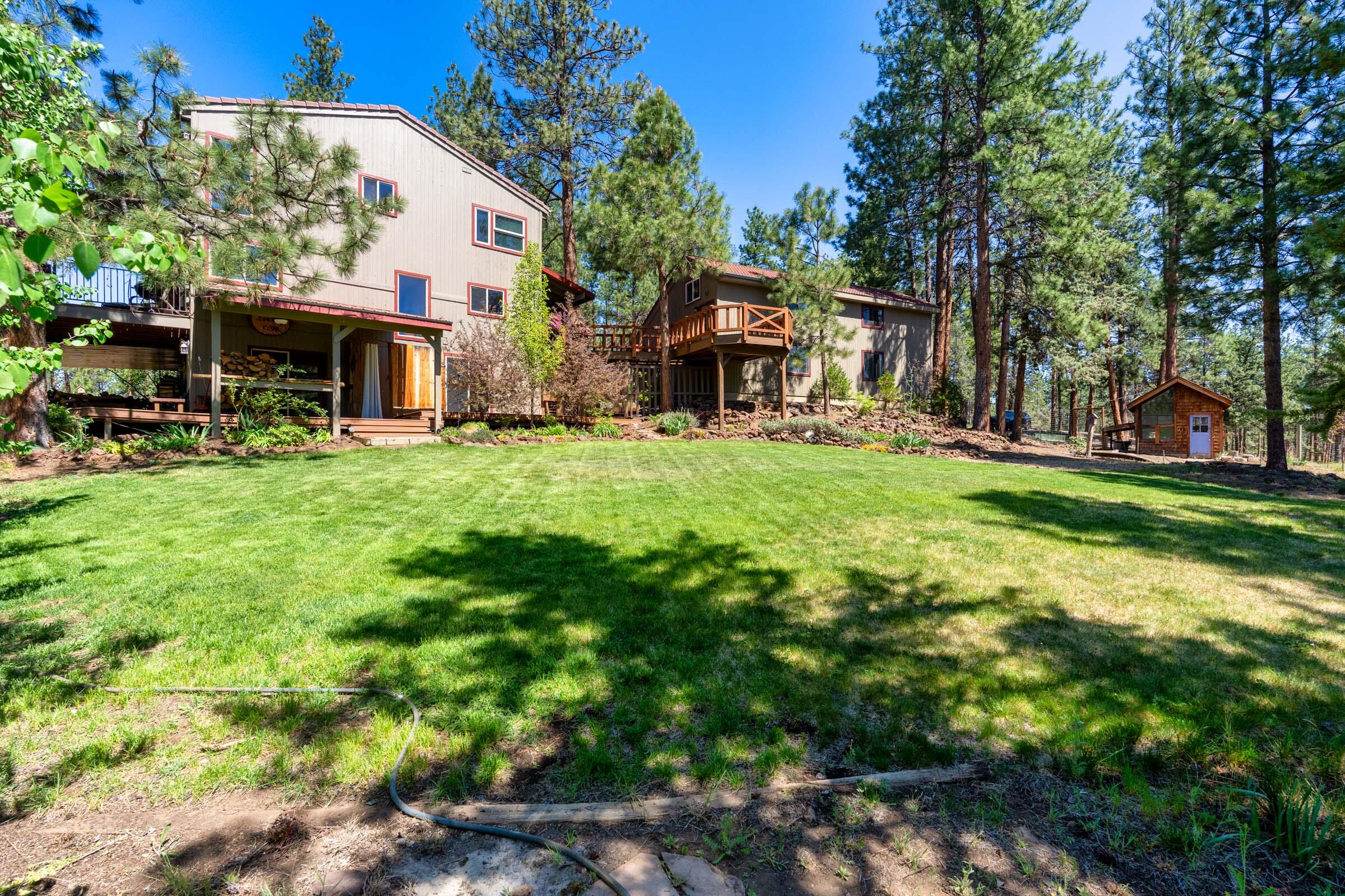 69470 Deer Ridge Road Sisters, OR 97759 - Photo 70 of 96 a view of a house with backyard and sitting area