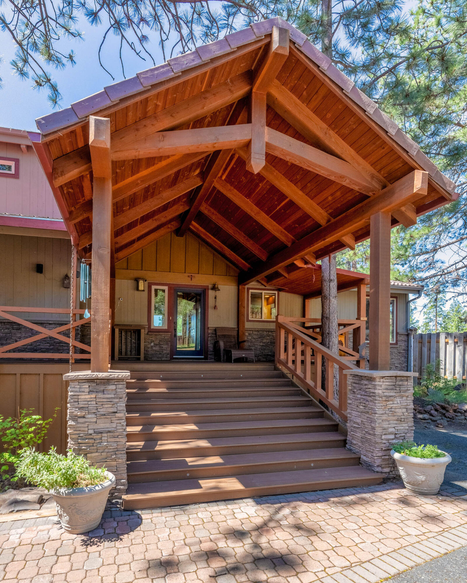 69470 Deer Ridge Road Sisters, OR 97759 - Photo 4 of 96 a front view of a house with a garden