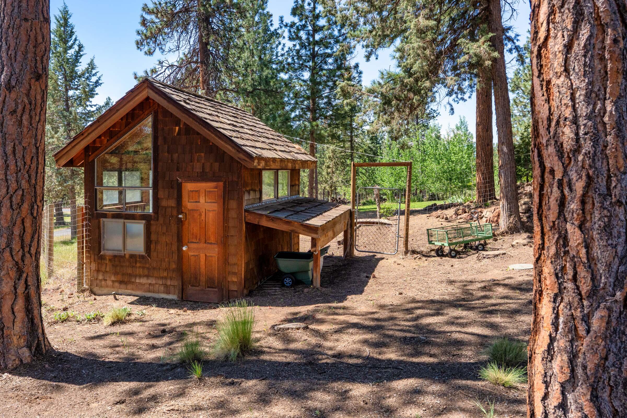69470 Deer Ridge Road Sisters, OR 97759 - Photo 76 of 96 a view of a house with a yard siting area and backyard