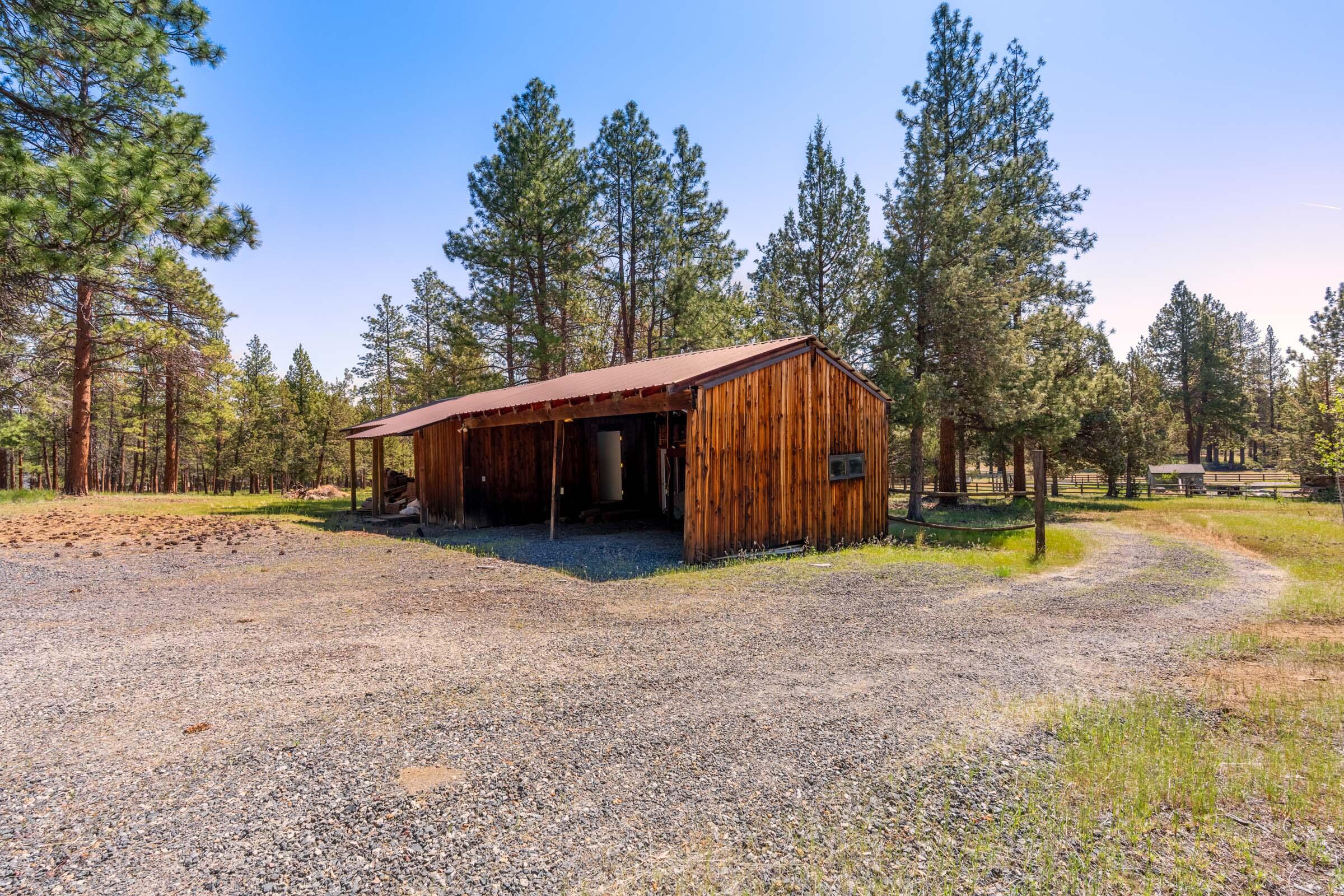 69470 Deer Ridge Road Sisters, OR 97759 - Photo 79 of 96 a view of a house with backyard and trees