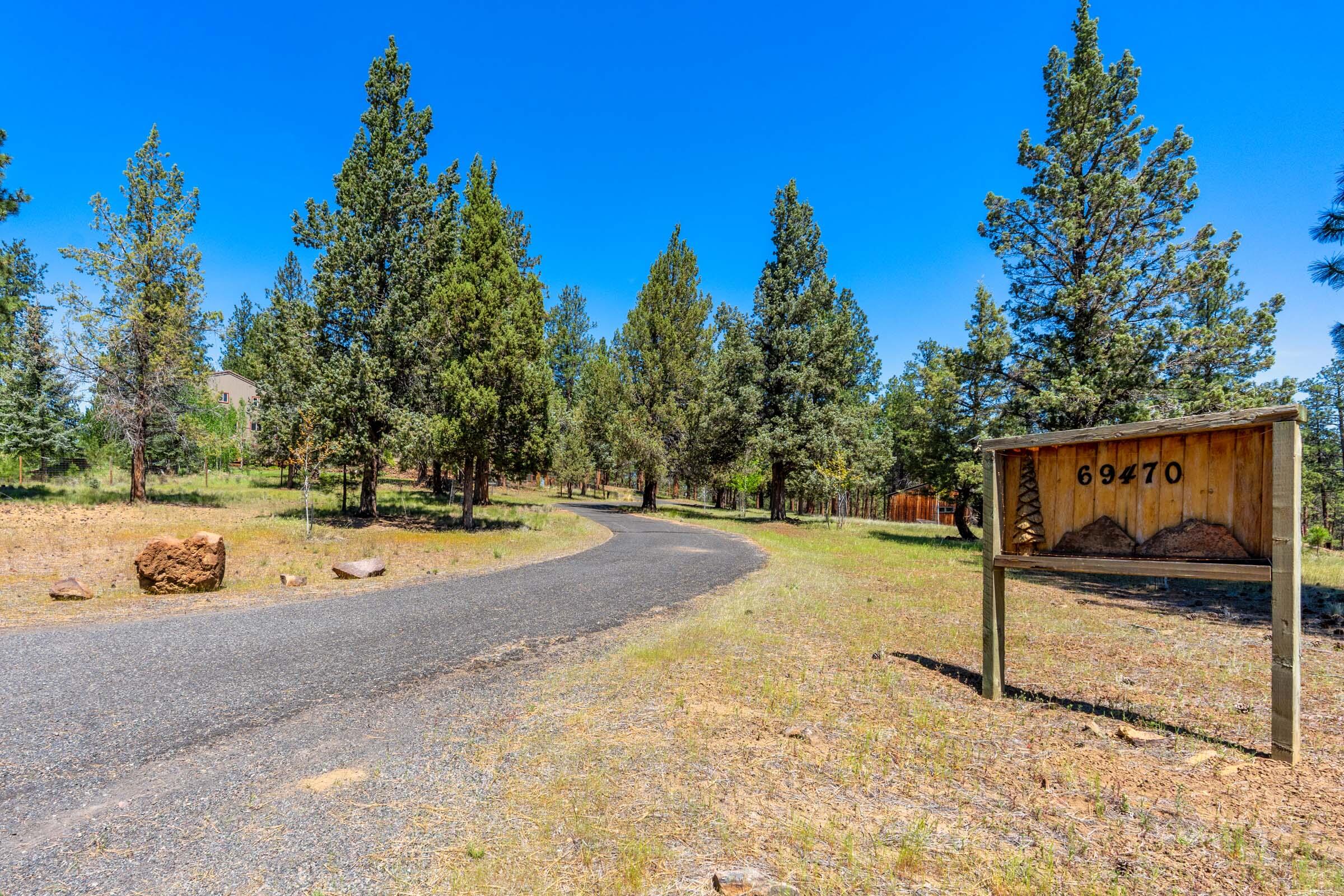 69470 Deer Ridge Road Sisters, OR 97759 - Photo 85 of 96 a view of a swimming pool with an outdoor space