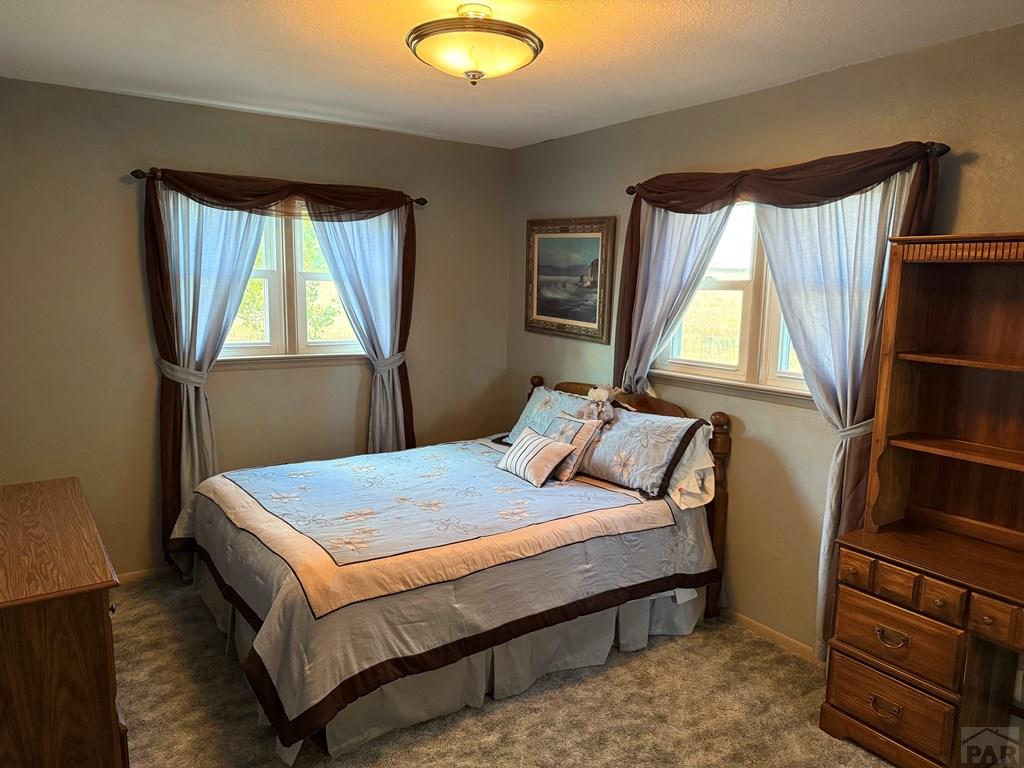 65281 Highway 50 Fowler, CO 81039 - Photo 10 of 16 a bedroom with a bed and a window