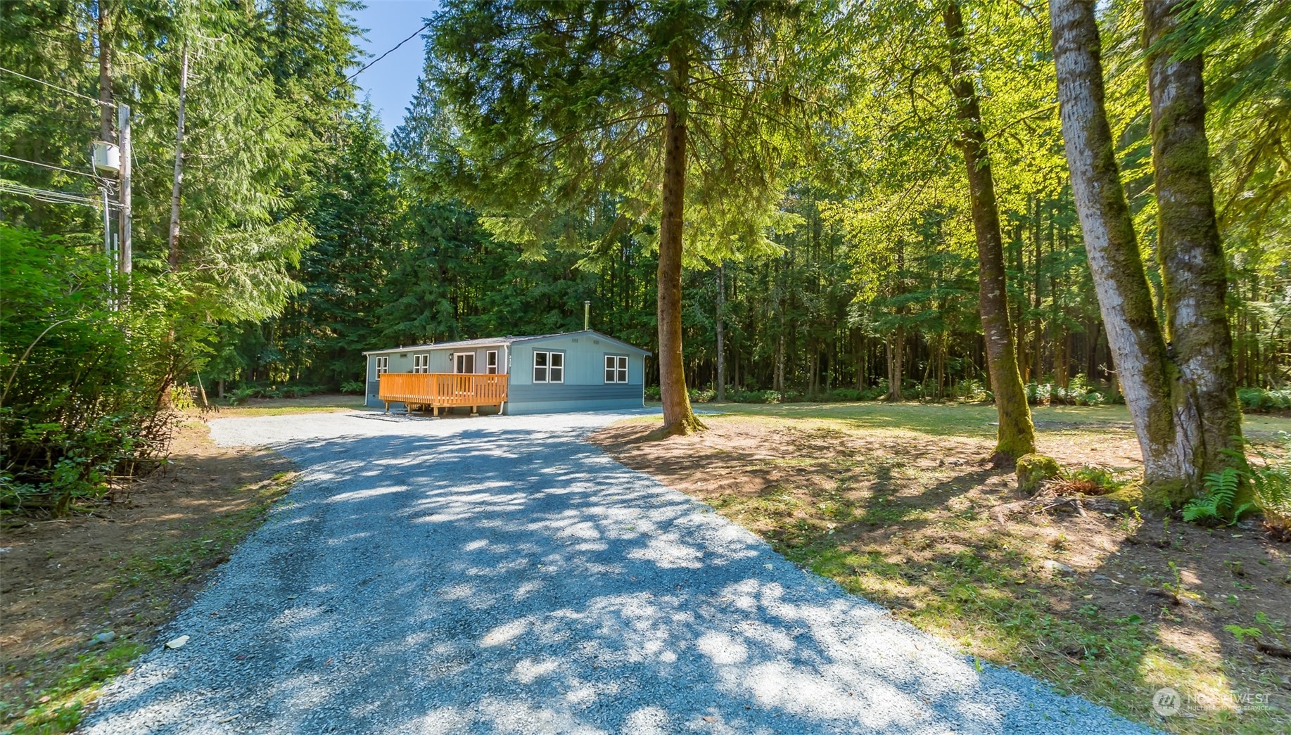 3429 Robe Menzel Road Granite Falls, WA 98252 - Photo 3 of 40 a backyard of a house with trees and outdoor seating