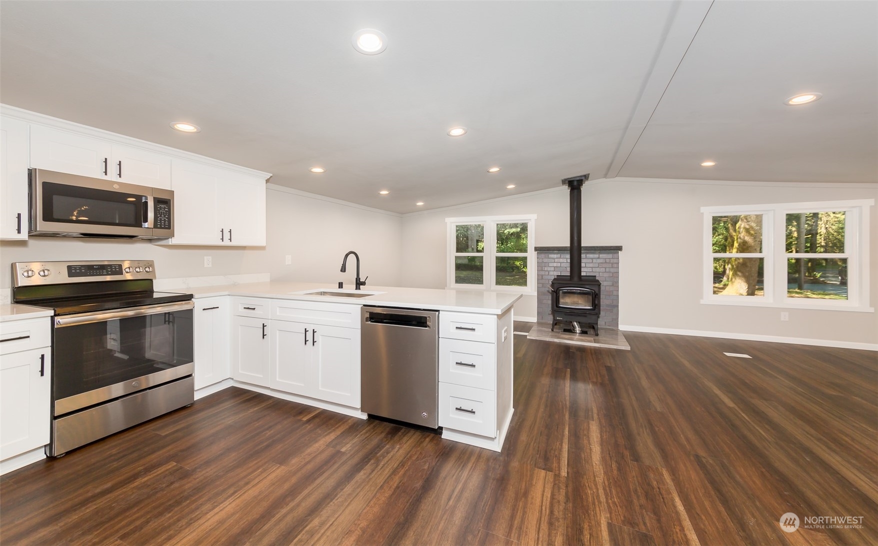 3429 Robe Menzel Road Granite Falls, WA 98252 - Photo 4 of 40 a kitchen with wooden floors and stainless steel appliances