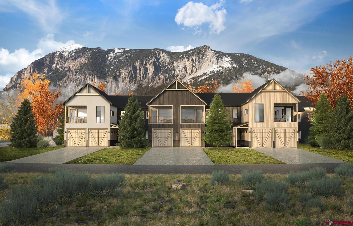 243 Elk Valley Road, Unit 1D Crested Butte, CO 81224 - Photo 1 of 8 a view of house with garden