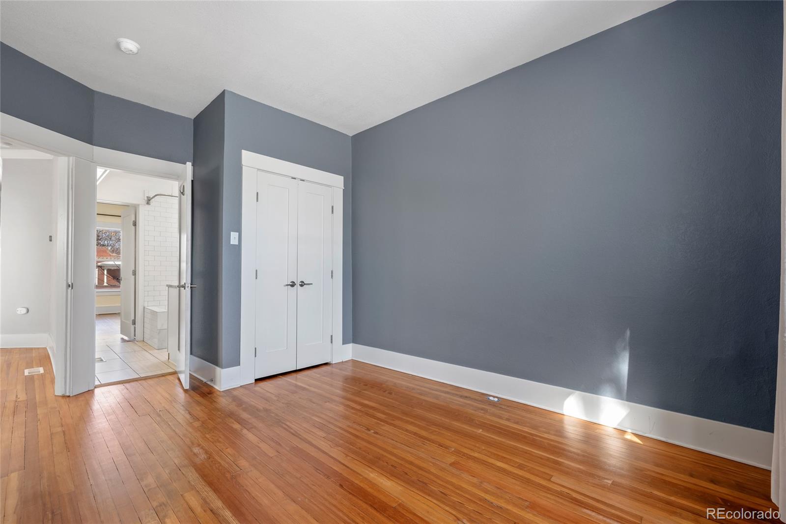 3340 Decatur Street Denver, CO 80211 - Photo 15 of 29 a view of an empty room with wooden floor