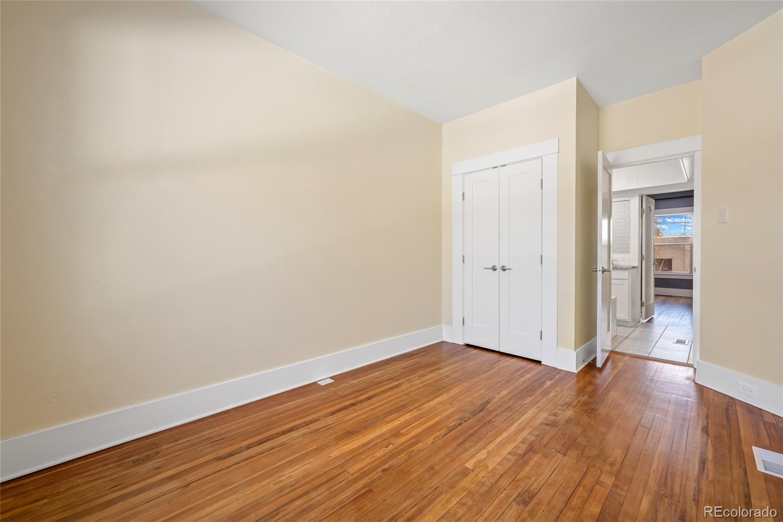 3340 Decatur Street Denver, CO 80211 - Photo 18 of 29 a view of an empty room with wooden floor