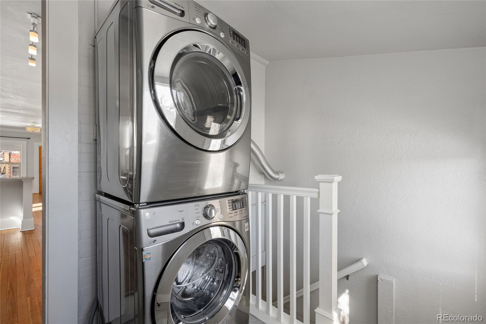 3340 Decatur Street Denver, CO 80211 - Photo 21 of 29 a view of a storage & utility room with dryer and washer